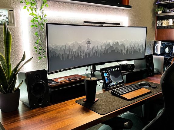 Brown and black wooden desk setup optimized for productivity