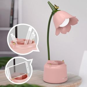 Pink Desk Lamp shaped like a flower with a bendable  green goose neck.