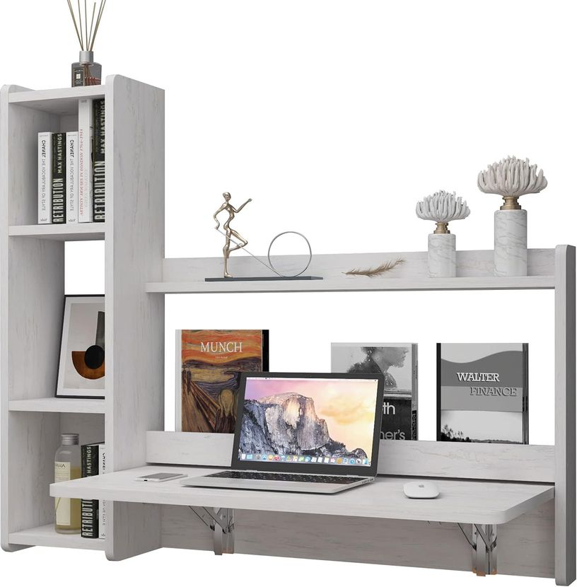 White wall mounted floating desk with storage shelves built in on the left side.