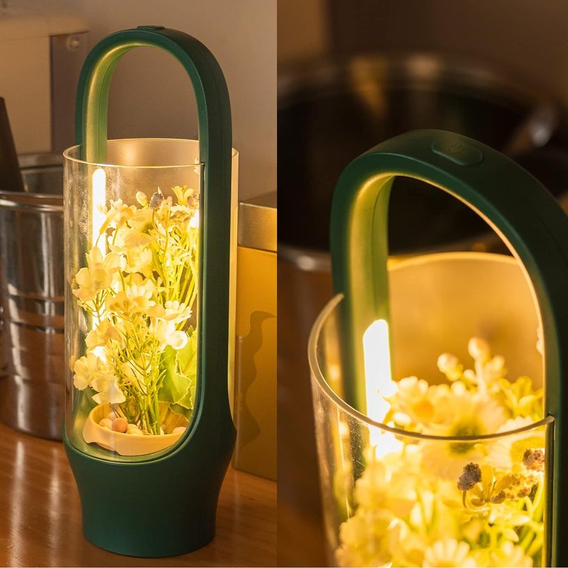 Stylish green lamp with a see-through cylinder that allows to grow plants on the inside.