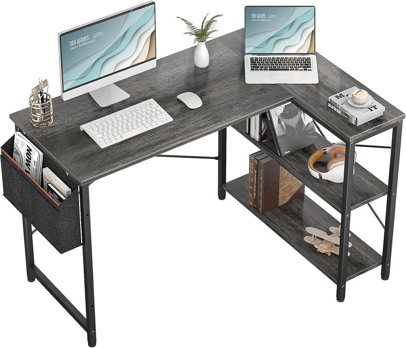 Grey L-Shaped desk with storage built into the side of the desk.