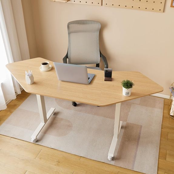 Electric sit stand desk with white metal legs and a wooden desk top.