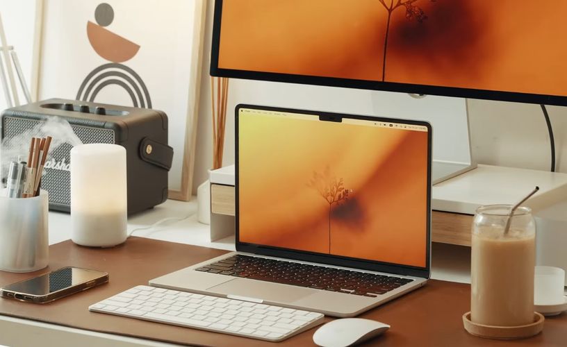 Close-up shot of a brown and white color scheme desk setup