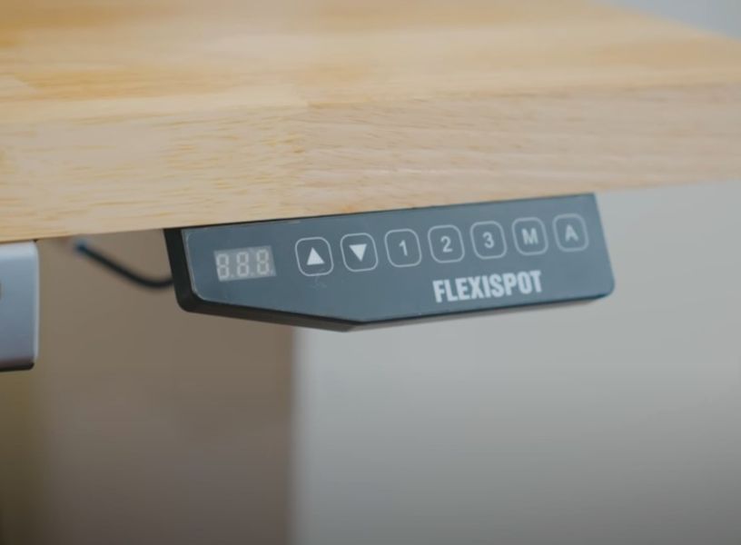 Close up of a FlexiSpot sit stand desk controller